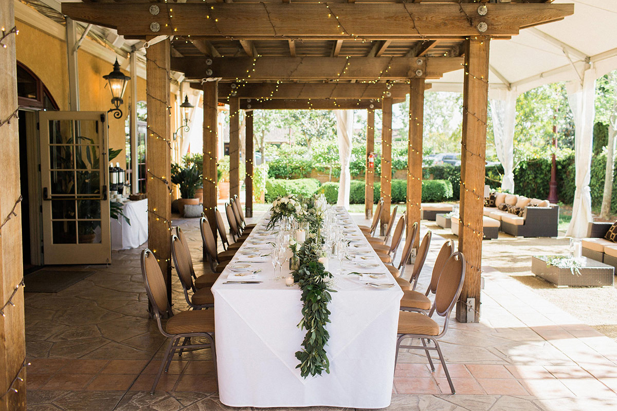 A beautiful dining table set up in the Cypress Terrace with lounge seatings along the garden.