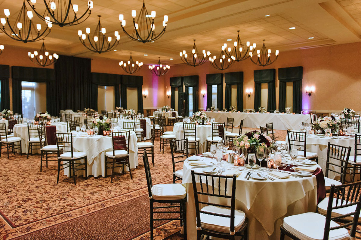 Banquet setting with table rounds for an everning event in the Rose Ballroom at Vintners Resort.