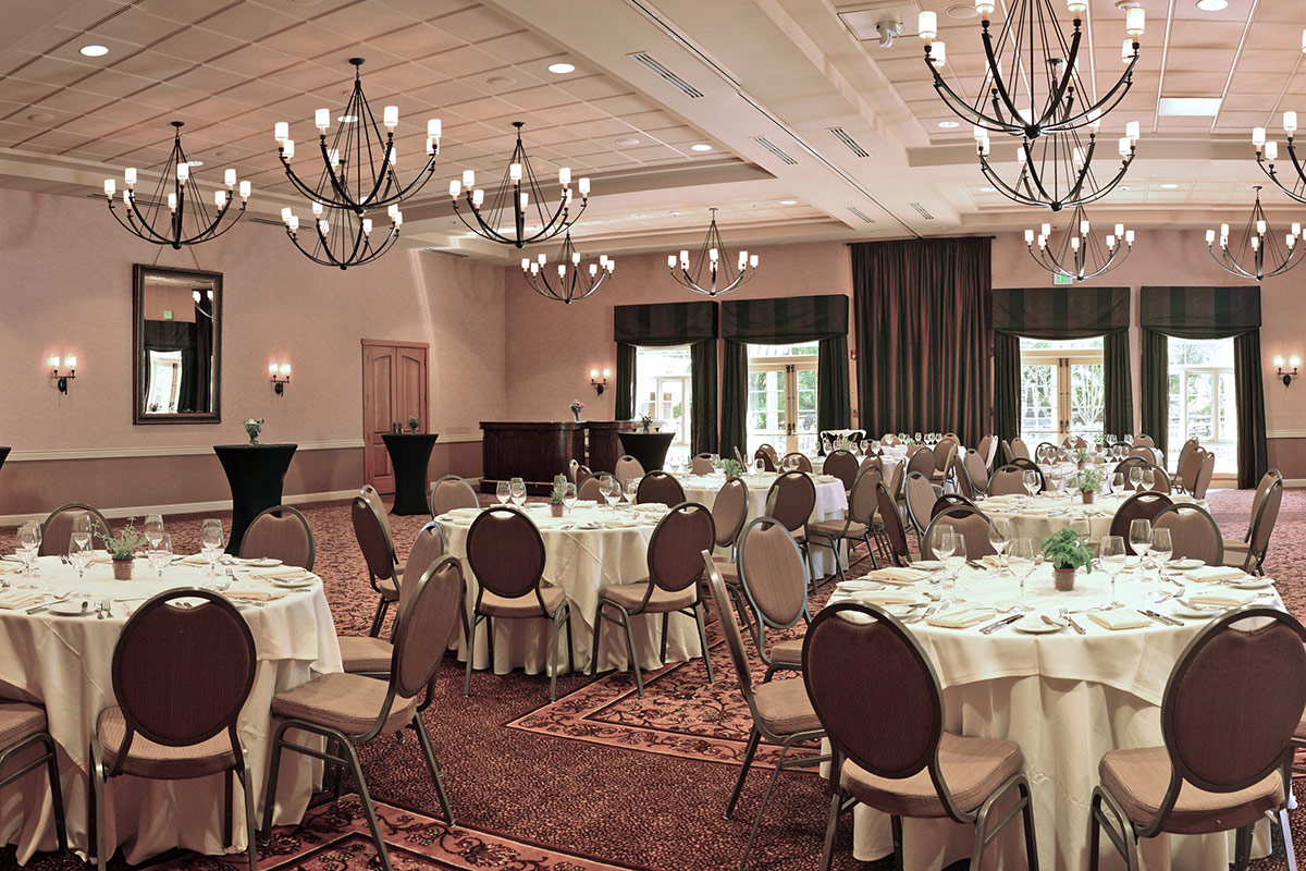 Banquet setting with table rounds for a private event in the Rose Ballroom at Vintners Resort.