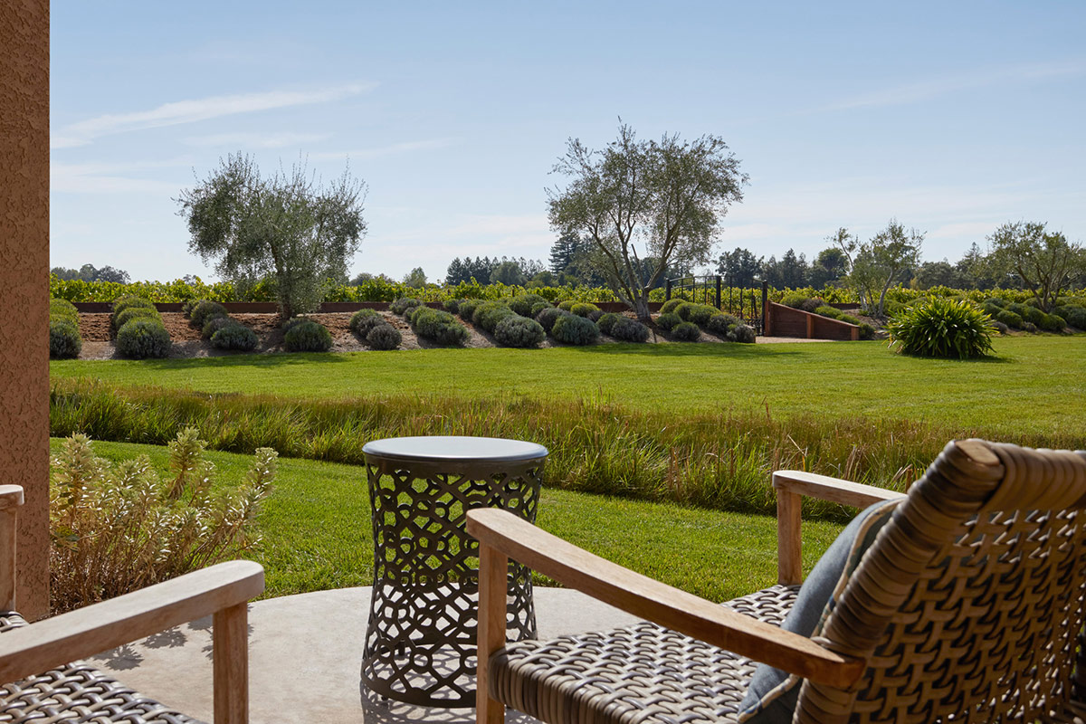 Furnished patio on the ground floor of Vintners Resort's guest accommodations, overlooks lavender fields and the vineyard.