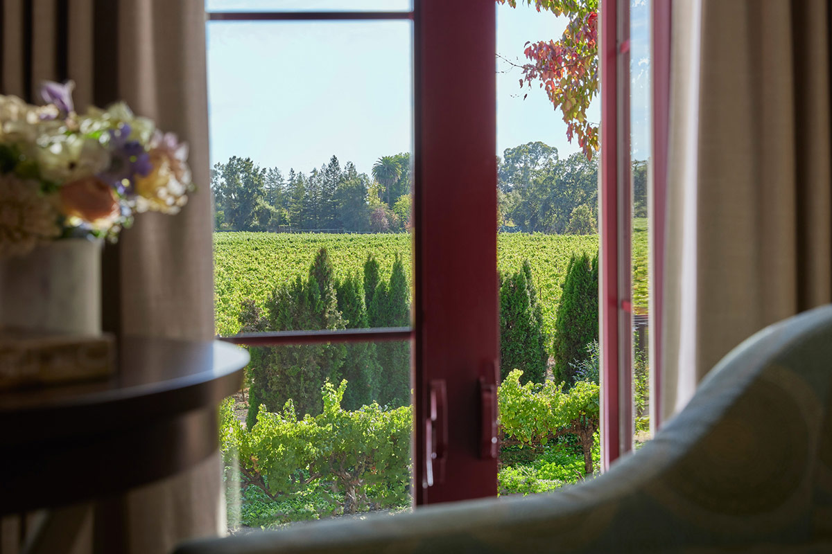 Close-up of a sitting area of the Courtyard Junior Suite at Vintners Resort with captivating views of the vineyards. Window opens to fresh air of the wine country.
