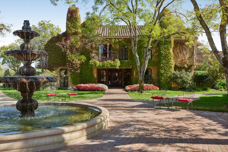 With climbing vines, an intimate and charming two-story guest accommodation at Vintners Resort, overlooks the beautiful garden courtyard and fountain.